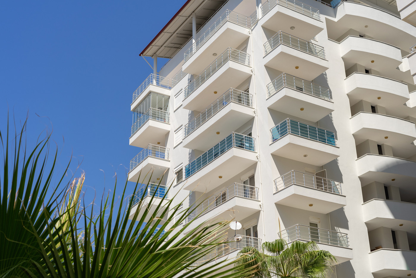 Residential apartment building. Blue sky.