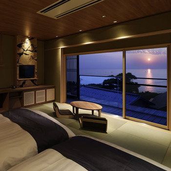 ベッドから日本海と夕日を眺める温泉旅館4066302