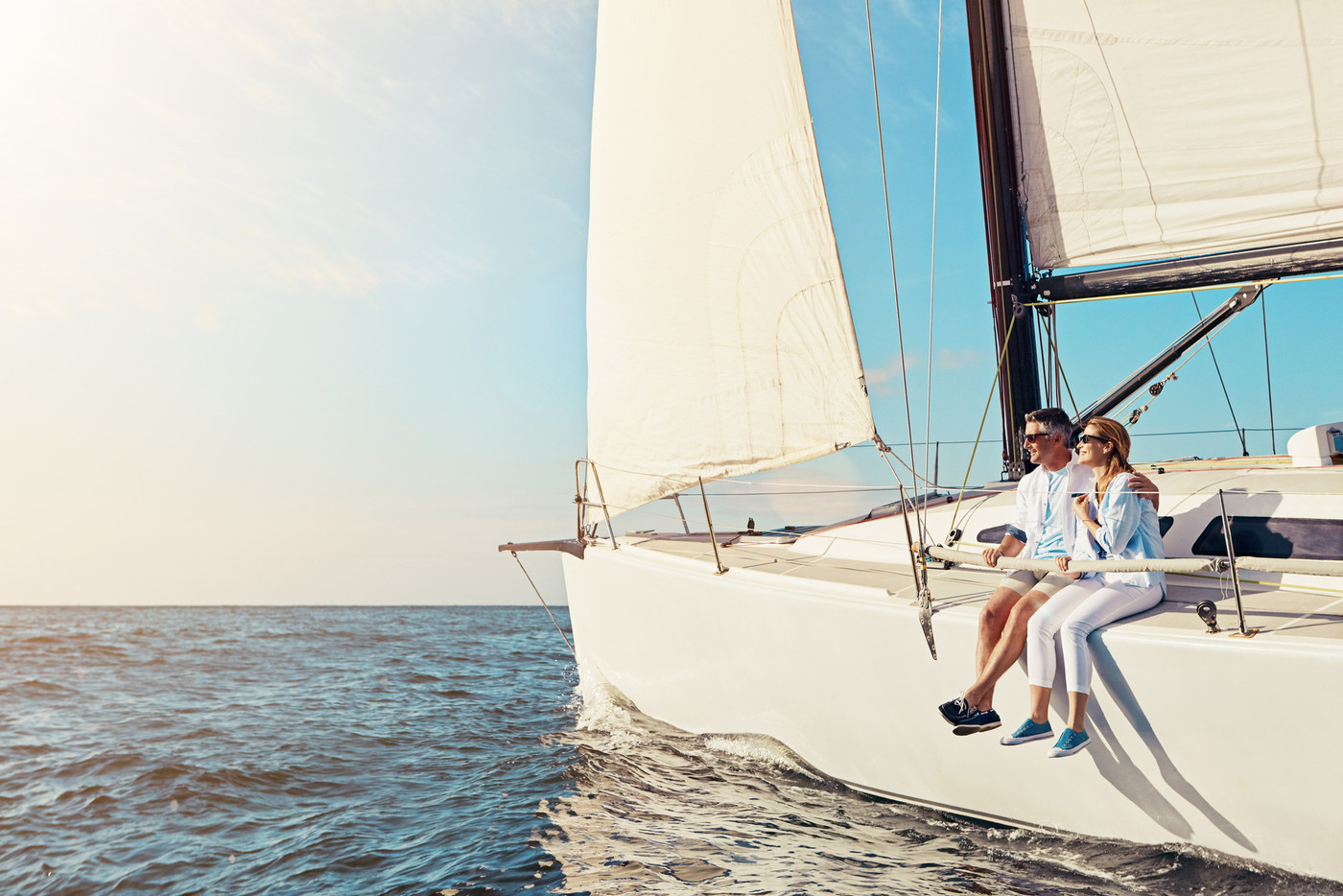 Relax, travel and luxury with couple on yacht for summer, love and sunset on Rome vacation trip. Adventure, journey and vip with man and woman sailing on boat for ocean, tropical and mockup