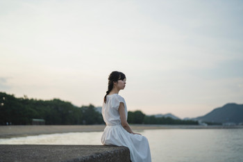 woman in the sea at sunset