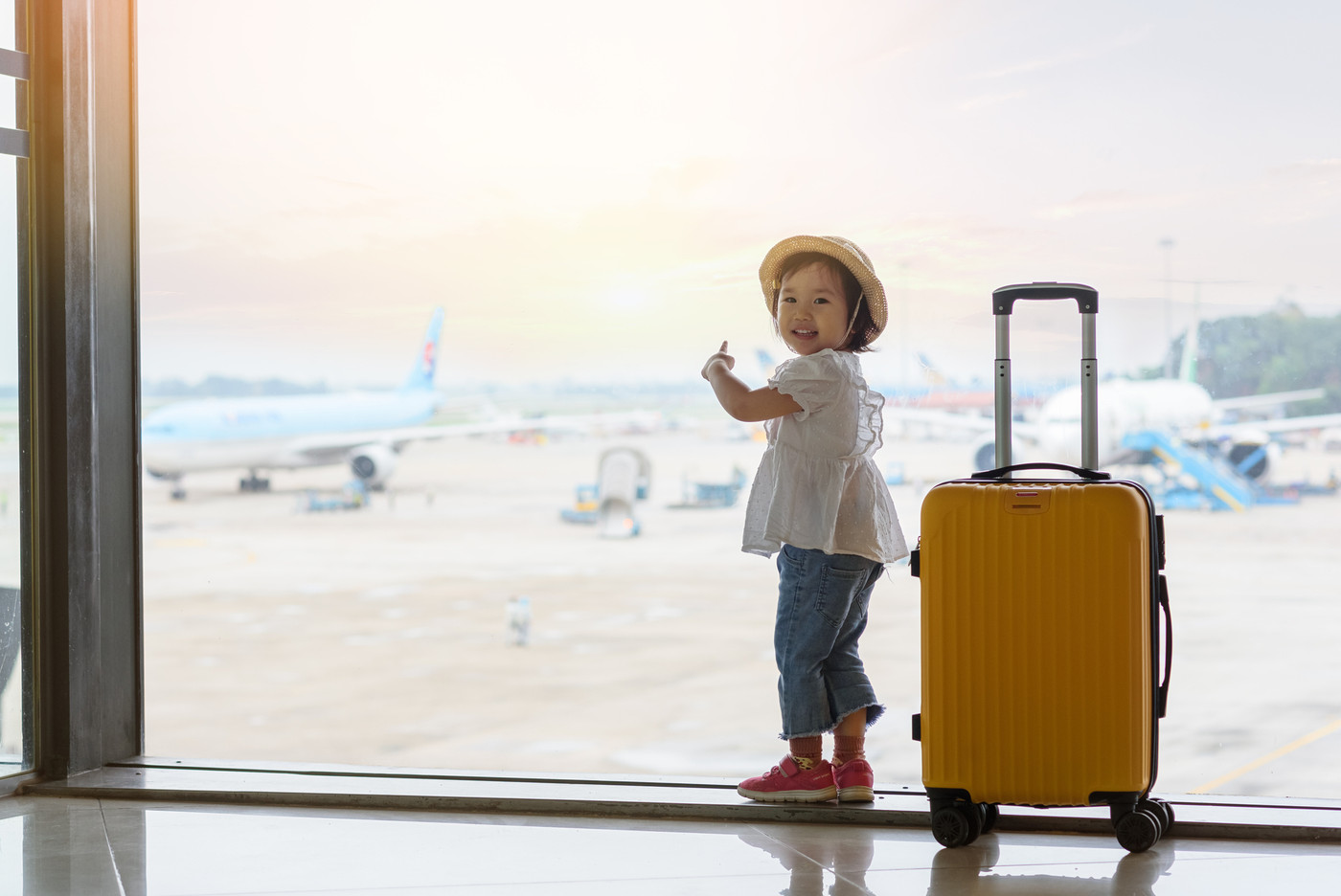 Baby looking at the plane in airport