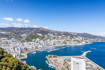 Atami City, Shizuoka Japan's leading onsen resort Atami cityscape on a sunny day