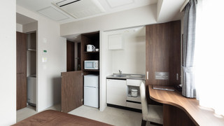 Single room with kitchen and washing machine