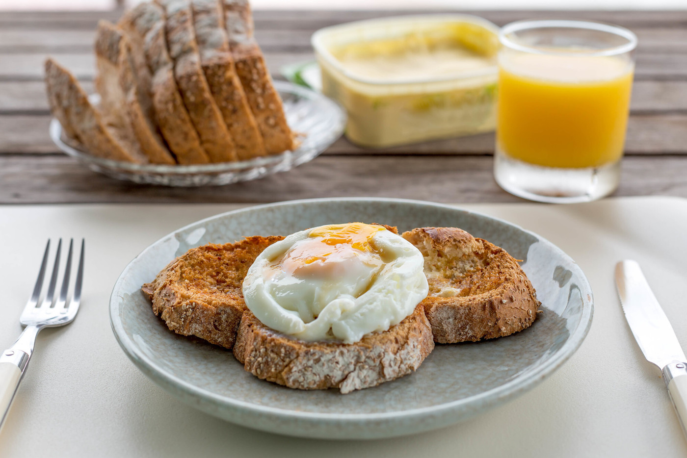 Breakfast fried eggs on toast with orange juice a
