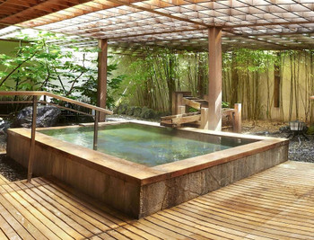 Baby boy in bath. Mother washing infant child.