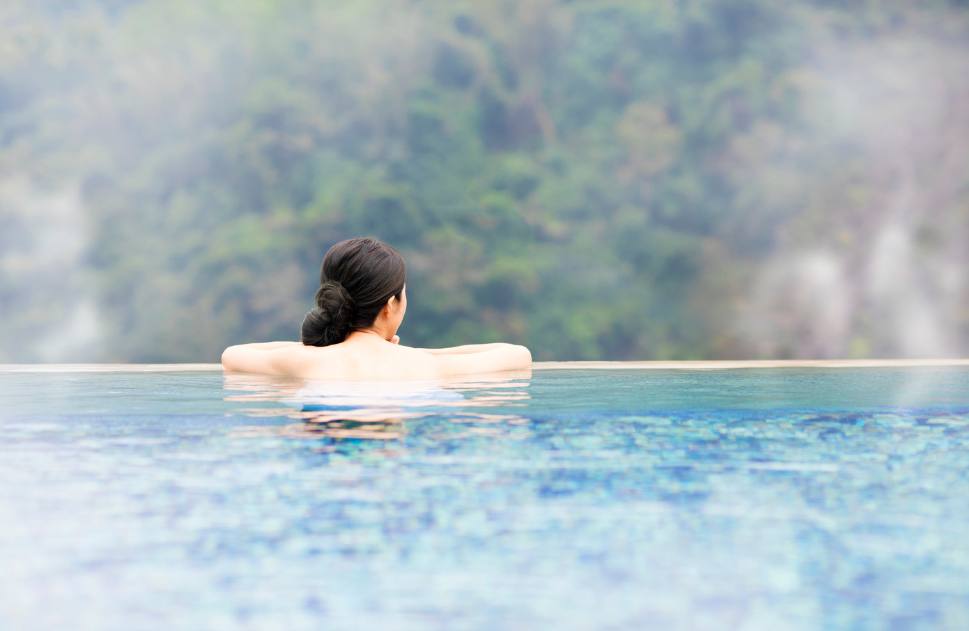 young woman relaxing in  hot springs