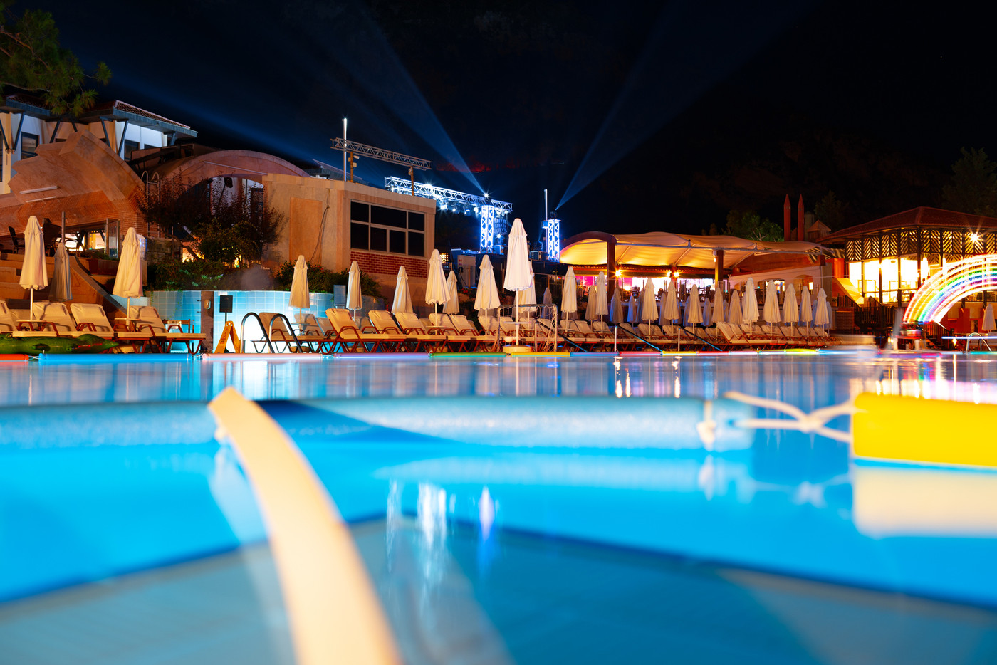 Swimming pool at a luxury resort at night time