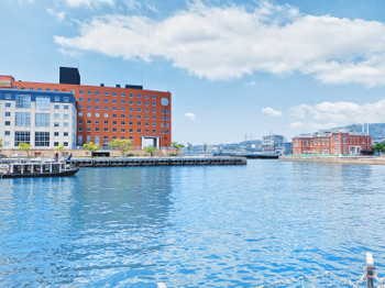 This is a photo of the Mojiko Hotel and the sea.