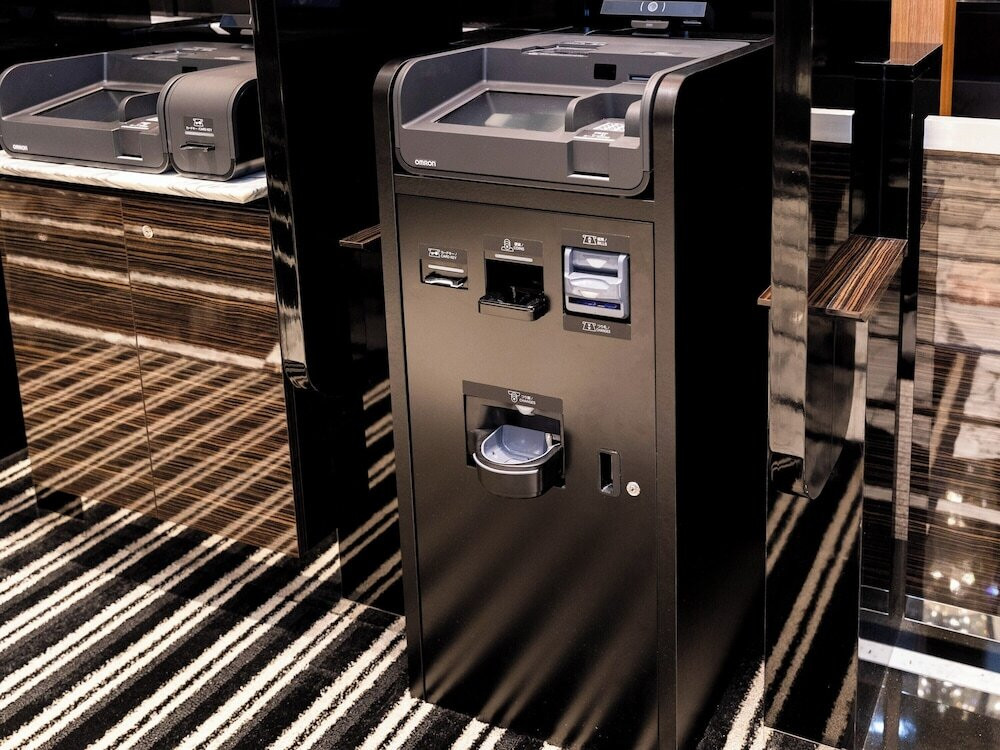 チェックイン / チェックアウト キオスク