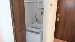 Single room with kitchen and washing machine