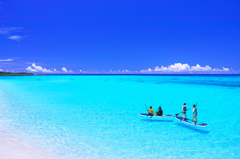 People enjoying marine sports in the beautiful sea along Shimoji Airport on Miyakojima in midsummer