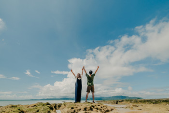 Tropical sky and couple