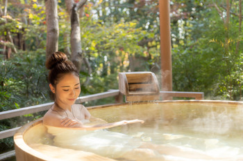 Young woman, onsen, open-air bath, travel