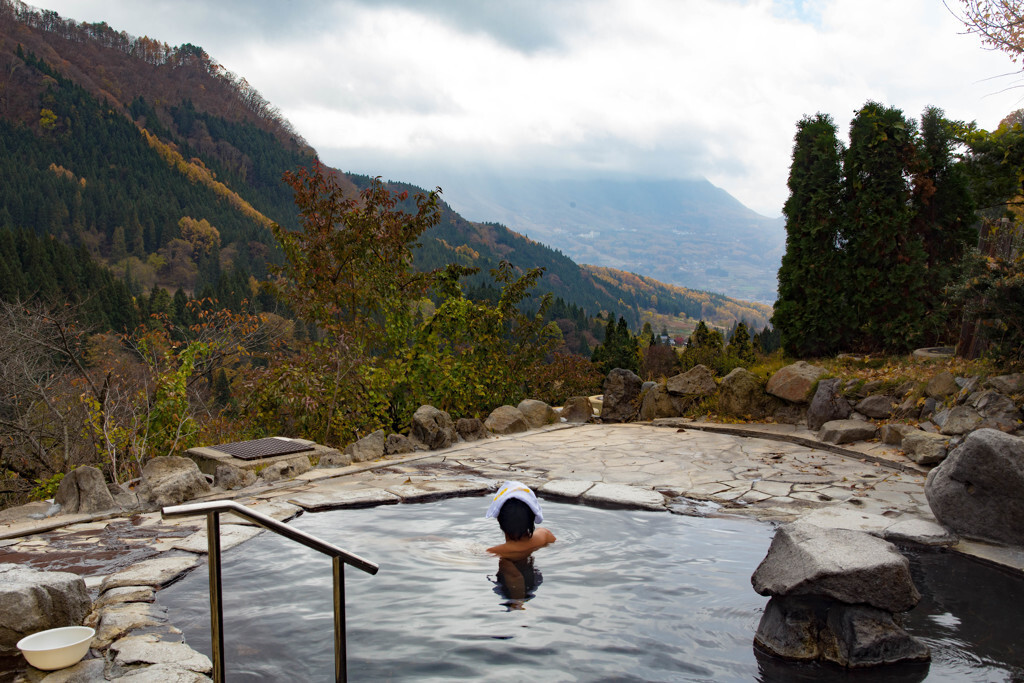 happy young woman relaxing in  hot springs