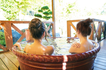 Woman taking an open-air bath