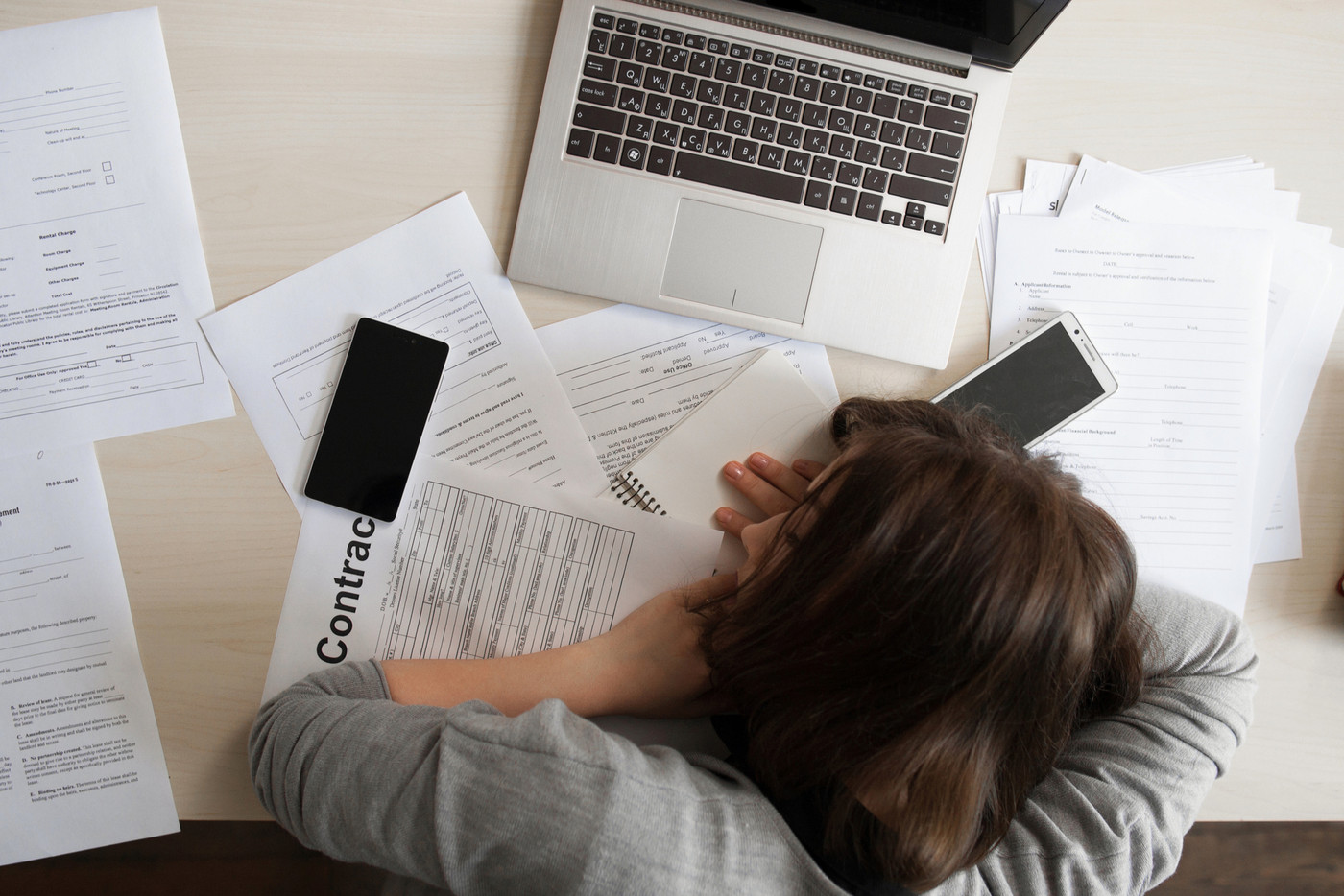 Tired business woman sleeping at work, flat lay