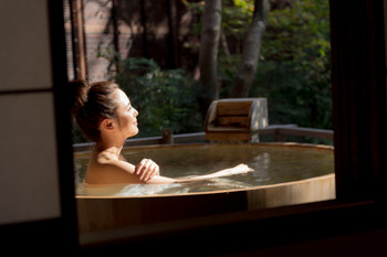 Young woman, onsen, open-air bath, travel