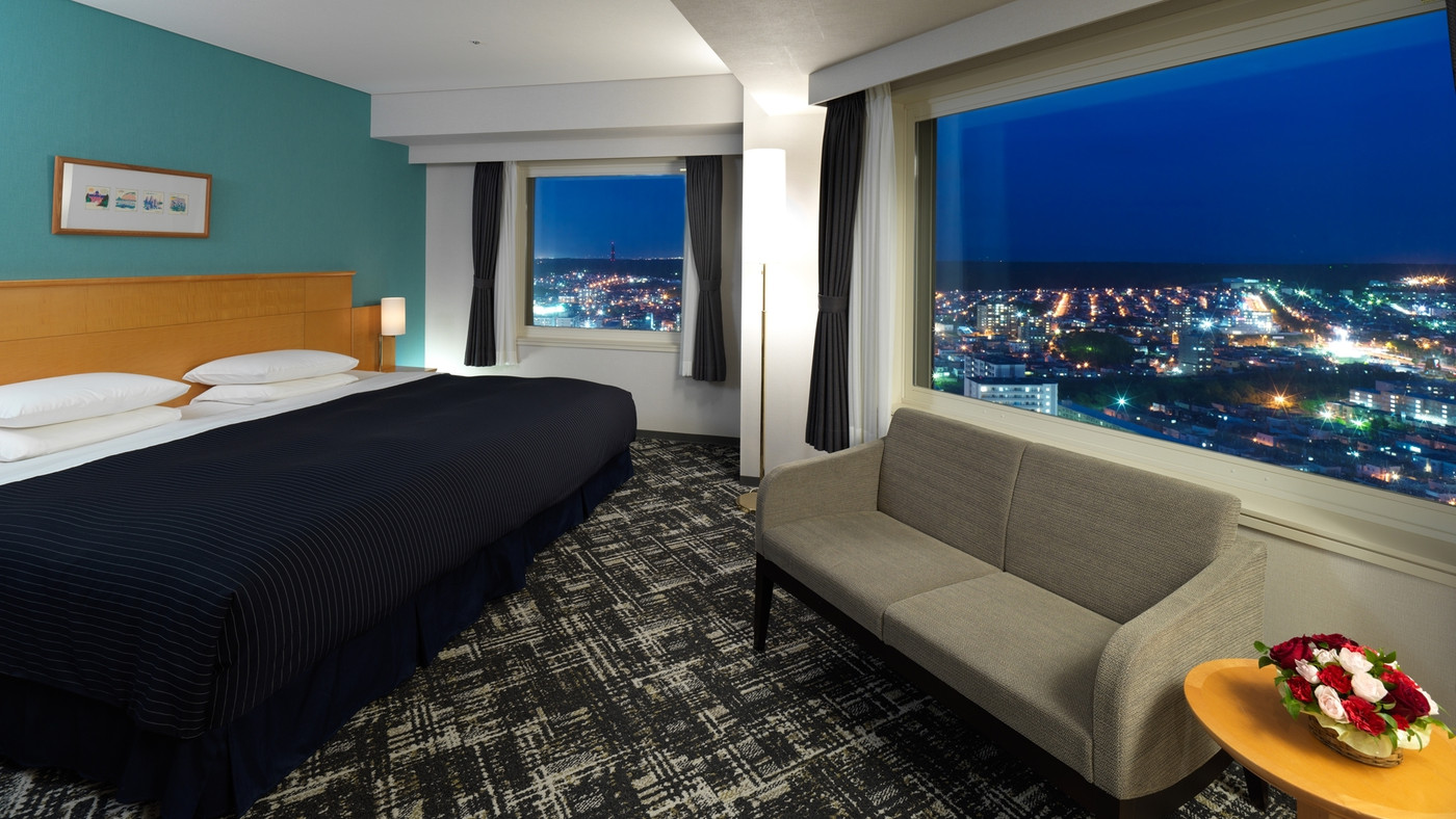 二方向に広がる夜景をコーナーのお部屋で楽しむ3394045