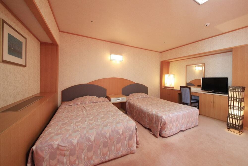 和洋室（10畳＋ツインベッド）のベッドルーム