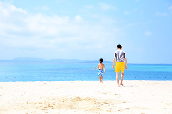 Parent and child playing in the sea