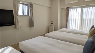 デラックス 4 人部屋 ベッド (複数台) 禁煙 シティビュー