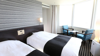 デラックス ツインルーム シングルベッド 2 台 (お子様料金についてはホテルポリシー欄詳細をご覧ください)