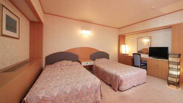 和洋室（10畳＋ツインベッド）のベッドルーム / 6