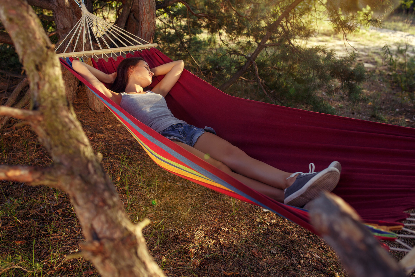 Party, camping. Woman sleeping at forest. She relaxing