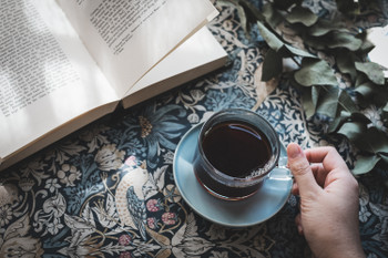 photo of holding a coffee cup