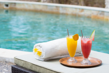 Pool and tropical juice at a tropical resort