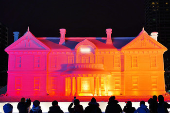 Large snow sculptures lit up at the Odori venue of the Sapporo Snow Festival