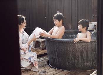 Parent and child taking a family bath