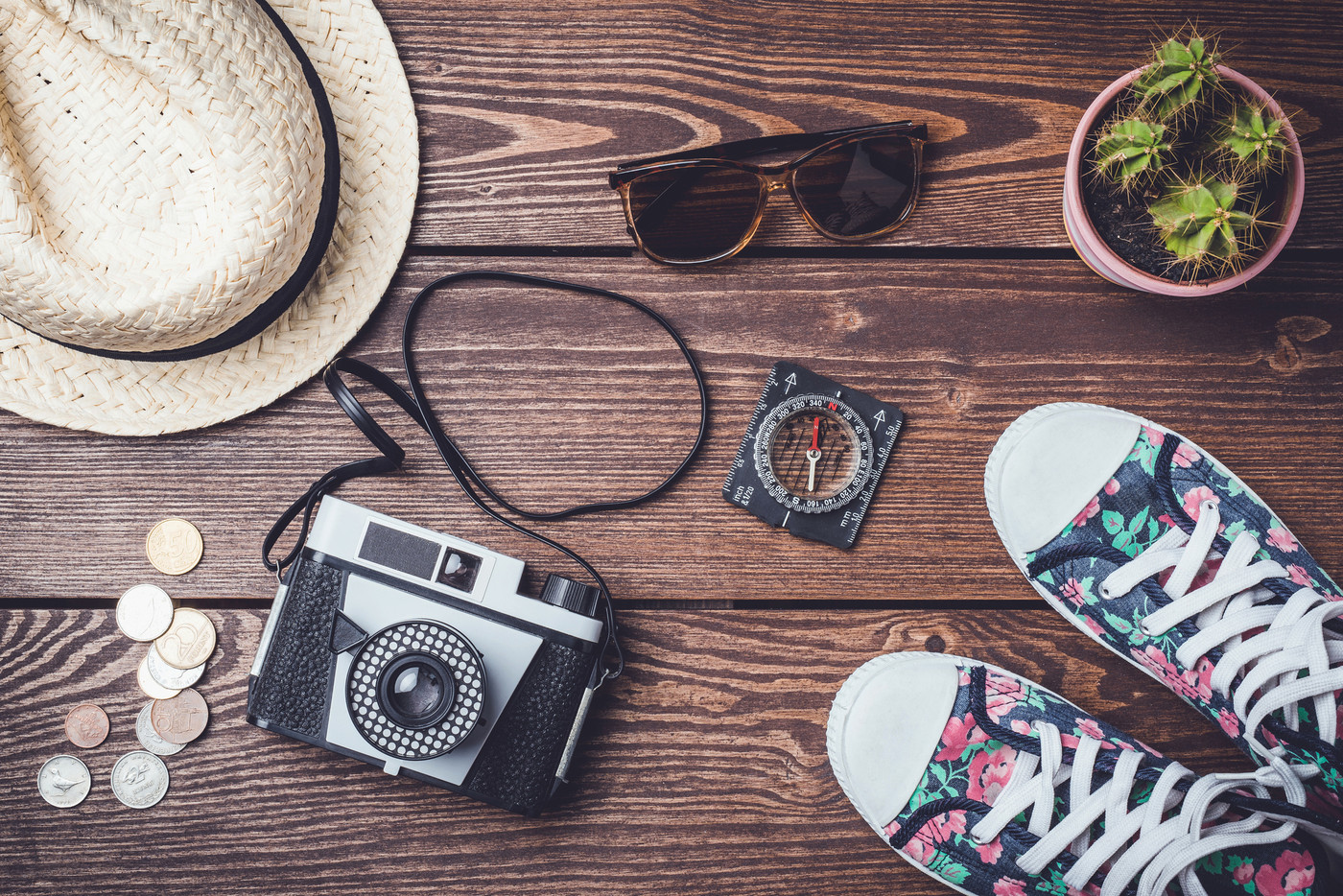 Travel accessories on wooden table