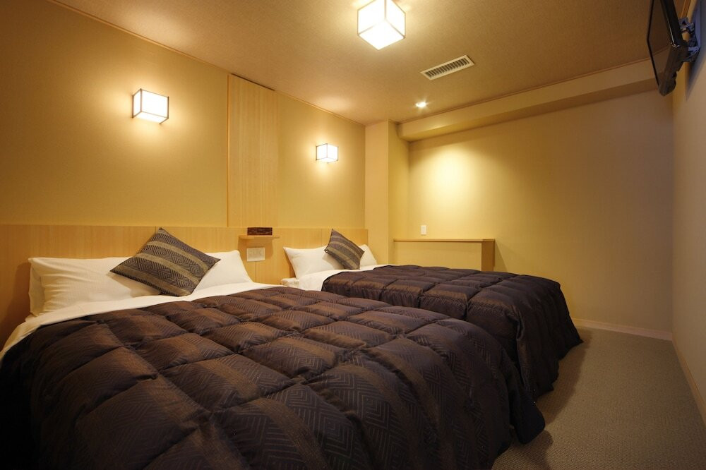 八番館 眺望風呂付和洋室一例／ベッドルーム